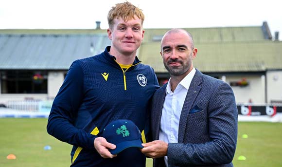 Jordan Neill receives his cap from Stuart Thompson (Cricket Ireland)