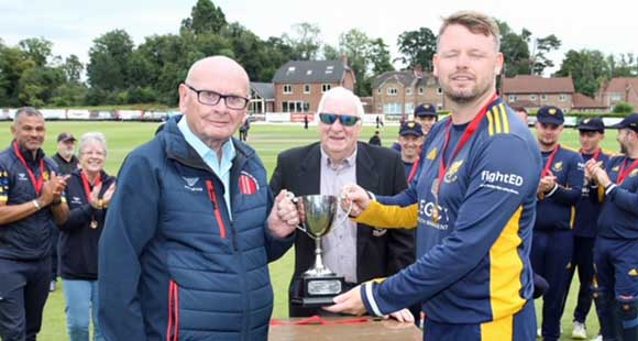 Bangor captain Johnny Parker receives the trophy from Bryan Milford of the NCU (CricketEurope)