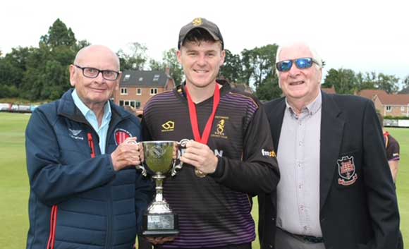 Instonains captain Ben Rose receives the cup (CricketEurope)