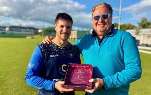 Ludwig Kaestner receives the Man-of-the-Match award from Gareth Evans